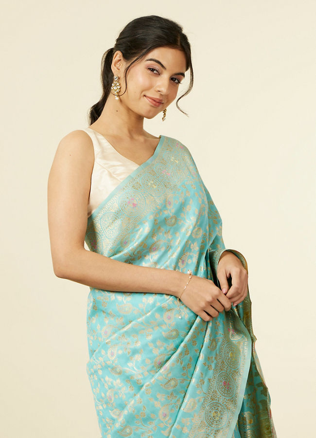 alt message - Mohey Women Light Blue Floral Zari Work Saree image number 1